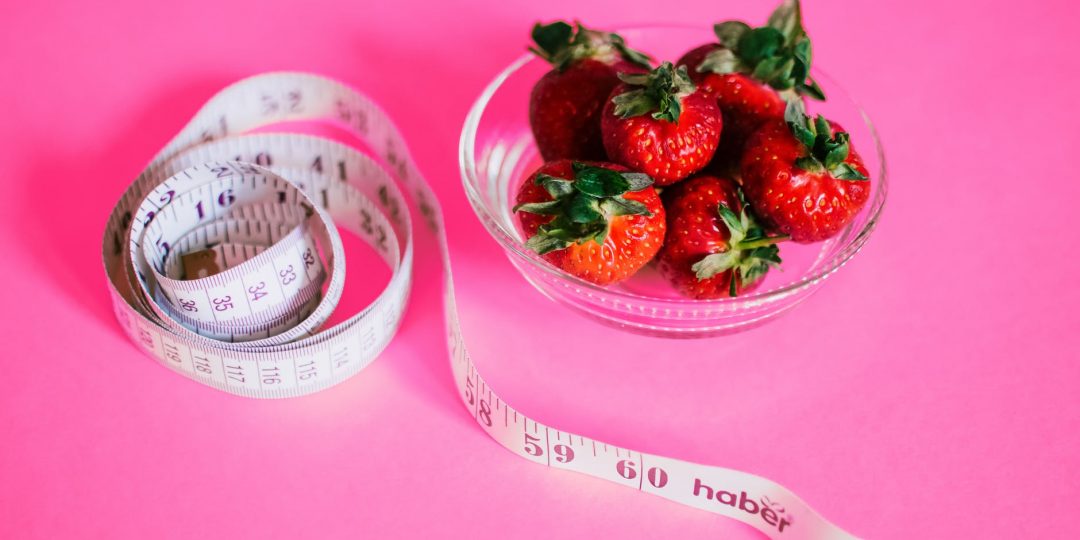 strawberries and measuring tape